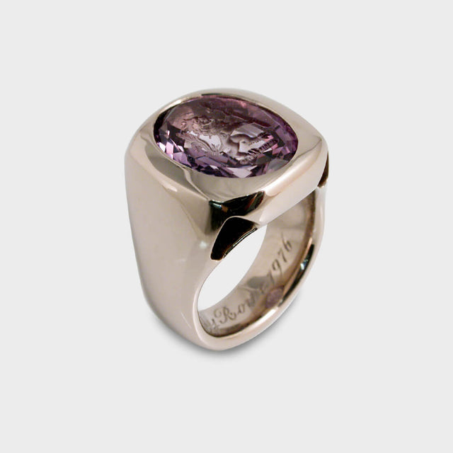 A bespoke white gold signet ring with an intaglio amethyst.